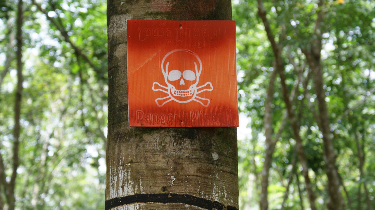 A warning sign for landmines in a field in Cambodia. (SONY DSC)