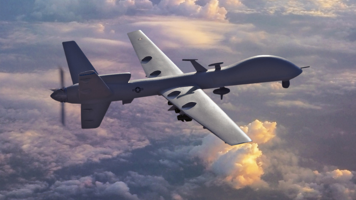 USAF General Atomics MQ-9 Reaper Unmanned Aerial Vehicle (UAV) in sunset clouds carrying Hellfire air-to-ground missiles. Where: Studio/Chino Hills. CA USA Who/What - I built a physical model and added details. Added my own original background aerial photo with PhotoShop.