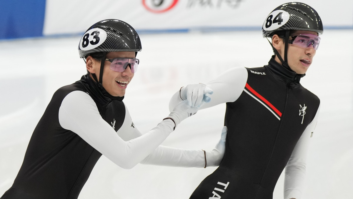 BEIJING, CHINA - APRIL 02: Sandor Liu Shaolin #83 and Liu Shaoang of Team Tianjin celebrates victory after the Mens 1000m final on day three of the National Short-track Speed Skating Championships at the Capital Gymnasium on April 2 2023 in Beijing, China. (Photo by Fred Lee/Getty Images)