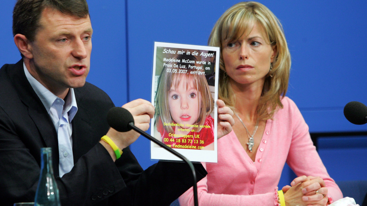 BERLIN - JUNE 06:  Kate and Gerry McCann, the parents of the missing 4-year-old British girl Madeleine McCann, display a poster of their missing daughter during a press conference on June 6, 2007 in Berlin, Germany. Kate and her husband Gerry are in Berlin to spread the word in the search for their missing duaghter Madeleine who disappeared from their holiday apartment in Praia da Luz, Portugal on May 3, 2007.  (Photo by Miguel Villagran/Getty Images)