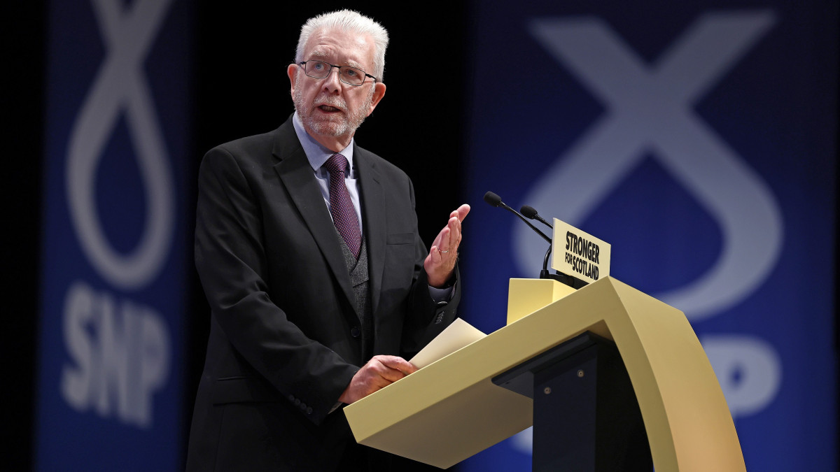 ABERDEEN, SCOTLAND - OCTOBER 09: SNP President and Political Director of the SNP Independence Unit Michael Russell addresses the Scottish National Party Conference on October 09, 2022 in Aberdeen, Scotland. This is the first time Scottish National Party Members have met for an in-person conference since October 2019 due to the Covid pandemic. Among resolutions being discussed are homelessness, renewable energy, mitigating the effects of the cost-of-living crisis and raising the school starting age.  (Photo by Jeff J Mitchell/Getty Images)