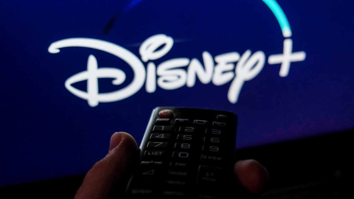 TV remote control is seen with Disney+ logo displayed on a screen in this illustration photo taken in Krakow, Poland on February 6, 2022. (Photo by Jakub Porzycki/NurPhoto via Getty Images)