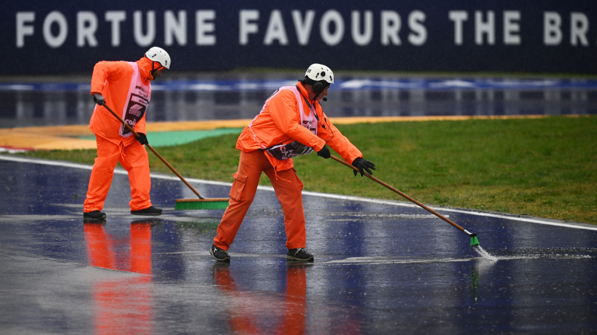 IMOLA, ITALY - APRIL 22: Track marshals try to clear rain water from the circuit during practice ahead of Round 2:Imola of the Formula 3 Championship at Autodromo Enzo e Dino Ferrari on April 22, 2022 in Imola, Italy. (Photo by Clive Mason/Getty Images)