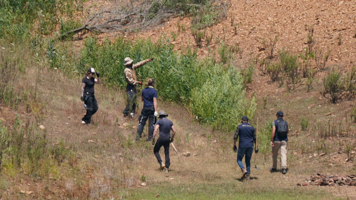 Personnel at Barragem do Arade reservoir, in the Algave, Portugal, as searches continue as part of the investigation into the disappearance of Madeleine McCann. The area is around 50km from Praia da Luz where Madeleine went missing in 2007. Picture date: Thursday May 25, 2023. (Photo by Yui Mok/PA Images via Getty Images)