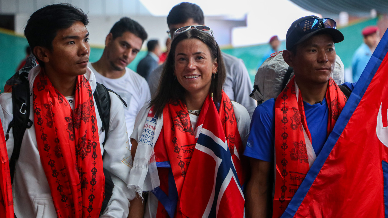 Norwegian climber Kristin Harila(C) and Tenjen Sherpa(L), set the record for the fastest summit of all 14 of the worlds 8,000-meter peaks, along with the youngest K2 summiteer, Nima Rinji Sherpa(R), arrival at the Tribhuvan International Airport in Kathmandu on 5th August, 2023. (Photo by Sanjit Pariyar/NurPhoto via Getty Images)