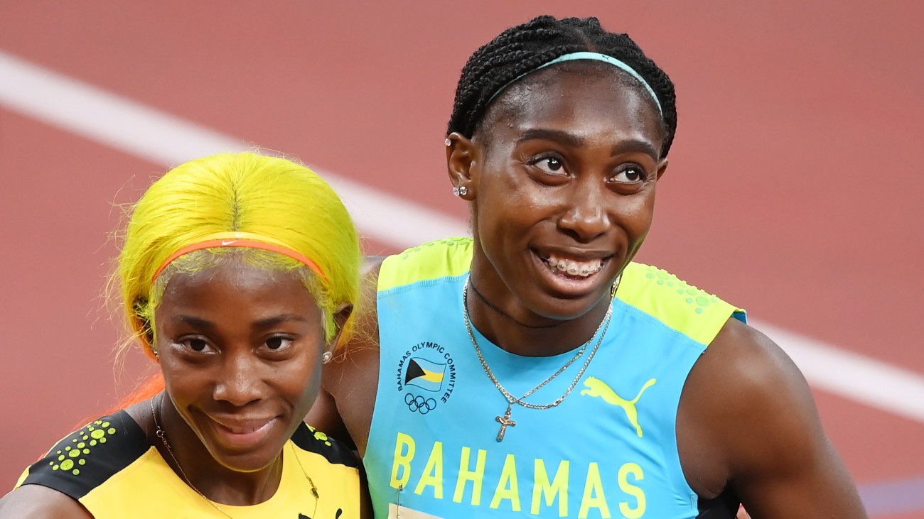 TOKYO, JAPAN - AUGUST 02:  Shelly-Ann Fraser-Pryce of Team Jamaica and Anthonique Strachan of Team Bahamas embrace after the Womens 200 metres semi finals on day ten of the Tokyo 2020 Olympic Games at Olympic Stadium on August 02, 2021 in Tokyo, Japan. (Photo by Matthias Hangst/Getty Images)