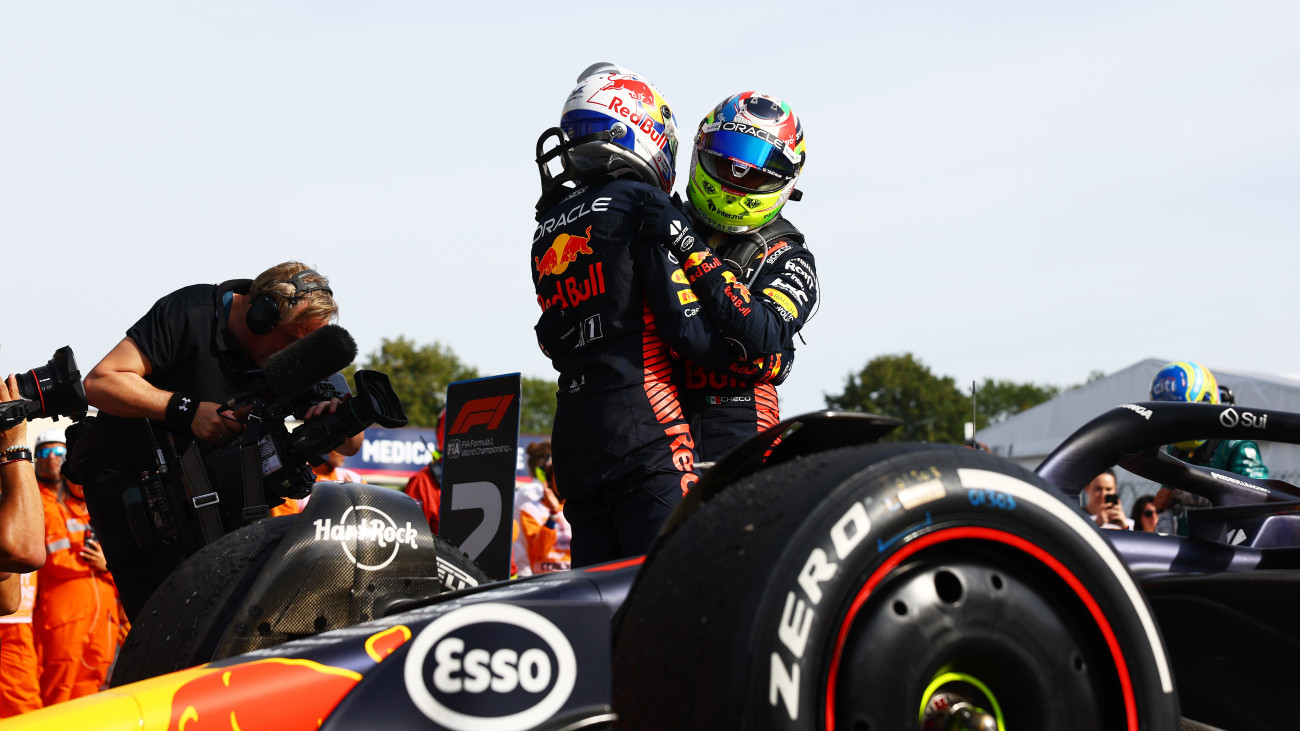 MONZA, ITALY - SEPTEMBER 03: Race winner Max Verstappen of the Netherlands and Oracle Red Bull Racing and Second placed Sergio Perez of Mexico and Oracle Red Bull Racing celebrate in parc ferme during the F1 Grand Prix of Italy at Autodromo Nazionale Monza on September 03, 2023 in Monza, Italy. (Photo by Mark Thompson/Getty Images)
