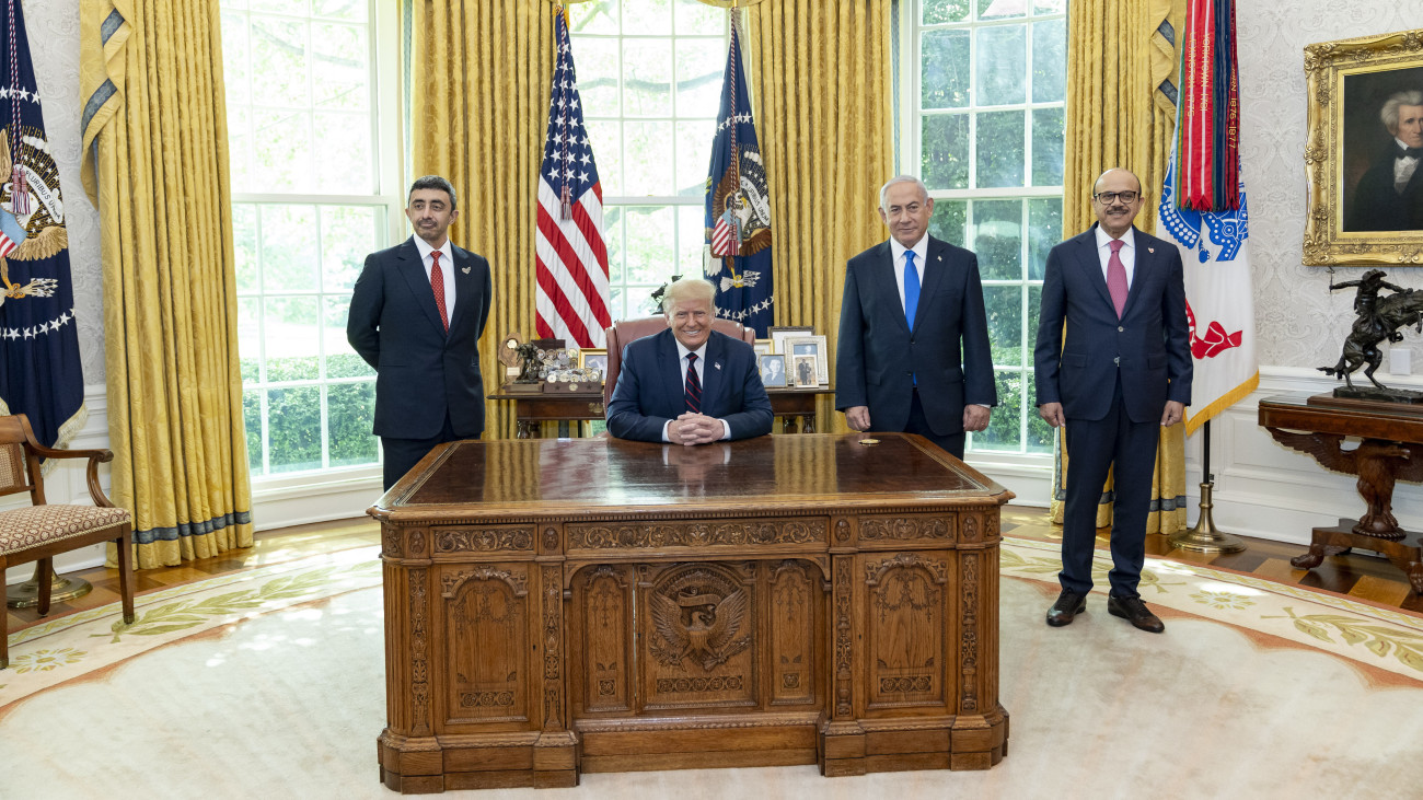 WASHINGTON, USA - SEPTEMBER 15: (----EDITORIAL USE ONLY Ă˘ MANDATORY CREDIT - THE WHITE HOUSE / SHEALAH CRAIGHEAD / HANDOUT - NO MARKETING NO ADVERTISING CAMPAIGNS - DISTRIBUTED AS A SERVICE TO CLIENTS----) U.S. President Donald Trump (2nd L), Israeli Prime Minister Benjamin Netanyahu (2nd R), UAE Foreign Minister Abdullah bin Zayed Al Nahyan (L) and Bahrain Foreign Minister Abdullatif bin Rashid Al Zayani (R) pose for a photo in the Oval Office before attending a signing ceremony for the agreements on normalization of relations reached between Israel, the United Arab Emirates (UAE) and Bahrain at the White House in Washington, United States on September 15, 2020. (Photo by The White House / Shealah Craighead / Handout/Anadolu Agency via Getty Images)