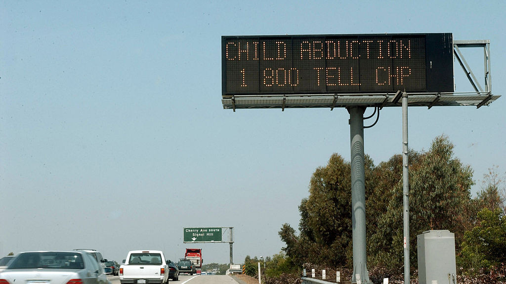 Traffic passes an automated sign on the San Diego Freeway in Long Beach, California, asking motorists to be on the lookout for a white Ford Bronco involved in the kidnapping of two teenage girls August 1, 2002, in the Quartz Hills area of the Antelope Valley. The Amber Alert utilizes immediate notification of news media outlets and freeway signage, offering descriptions of suspects vehicles to help track them down. The two teenage girls, abducted at gunpoint in Southern California early Thursday, were rescued by sheriff?s deputies, who shot and killed the kidnapper about 80 miles northwest of the crime scene. (Photo by Bob Riha Jr/WireImage) *** Local Caption ***