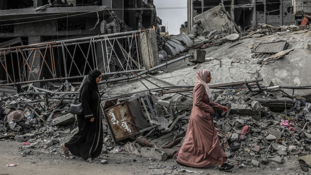 28 October 2023, Palestinian Territories, Rafah: Palestinian walks past a destroyed building, amid the ongoing battles between Israel and the Palestinian group Hamas. Photo: Abed Rahim Khatib/dpa (Photo by Abed Rahim Khatib/picture alliance via Getty Images)