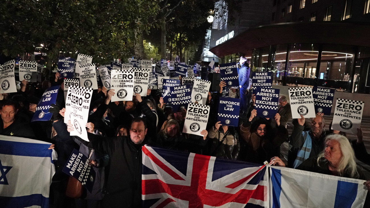 People attend a Campaign Against Antisemitism rally outside New Scotland Yard in central London, seeking police action amid a rise in antisemitic incidents. (Photo by Jordan Pettitt/PA Images via Getty Images)
