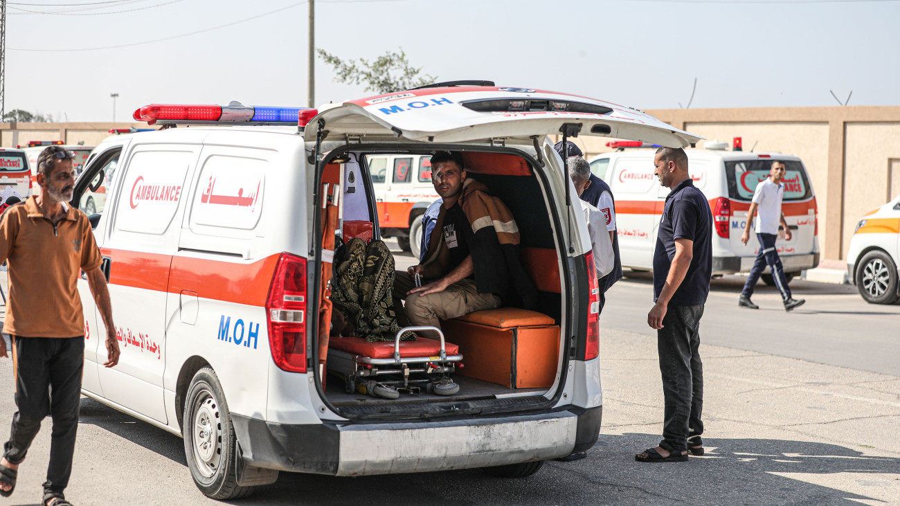 RAFAH, GAZA - NOVEMBER 01: Ambulances from Egypt wait to pass through Rafah border crossing to transport seriously wounded Palestinians after Israeli attacks in Rafah, Gaza on November 01, 2023. (Photo by Mustafa Hassona/Anadolu via Getty Images)