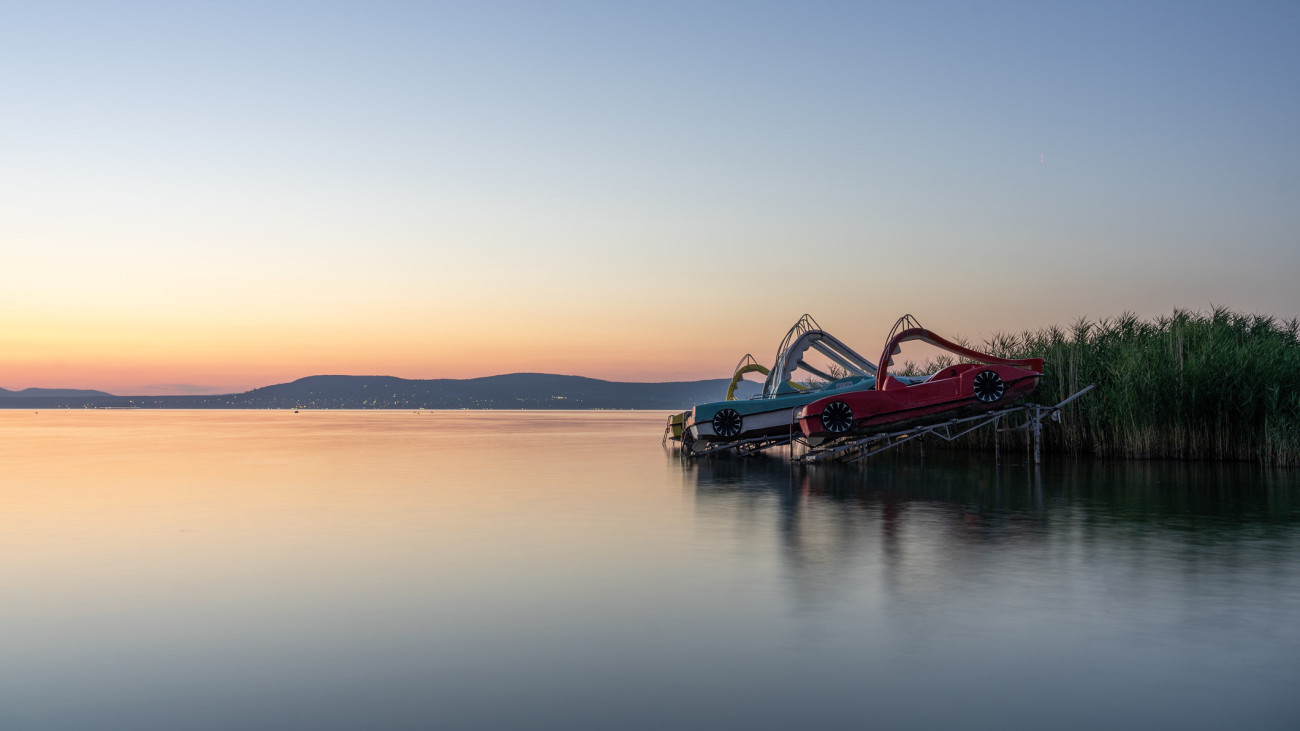 paddle boat funny activity in the sunset with a slide on the lake Balaton in Hungary .