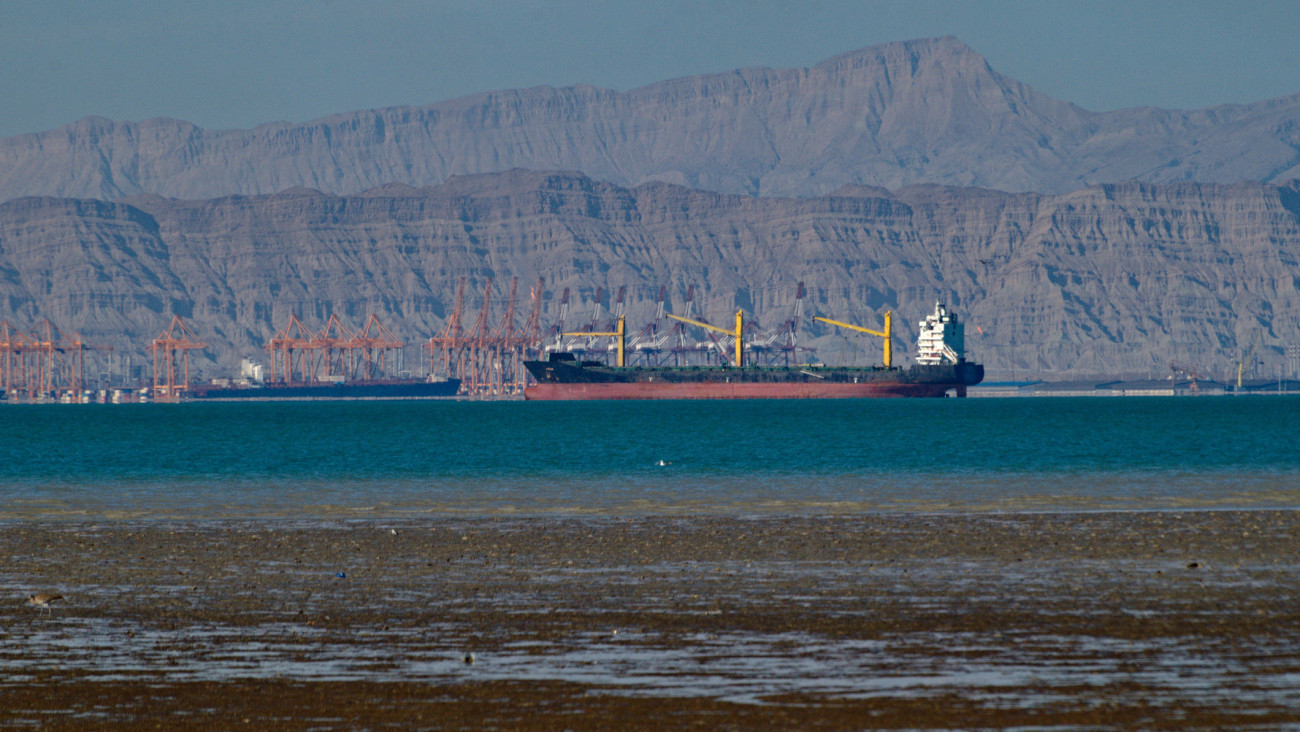Large cargo ship at Shahid Rajai port from Dargahan in low tide from Qeshm island, Persian Gulf, Iran