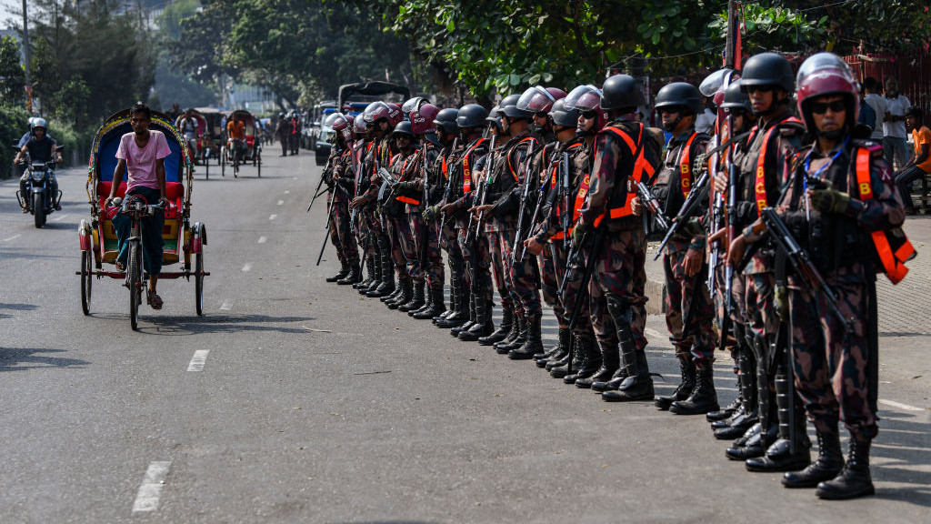 Border Guard Bangladesh (BGB) personnel stand guard during a protest by garment workers demanding an increase in their wages in Dhaka, Bangladesh, on November 01, 2023.  (Photo by Zabed Hasnain Chowdhury/NurPhoto via Getty Images)