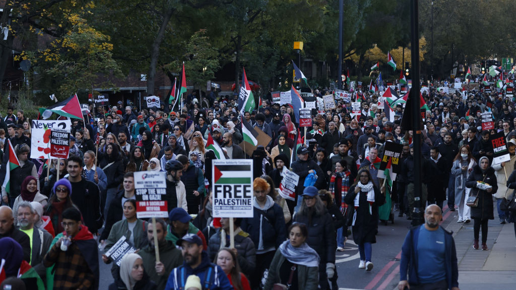 Protesters march during a pro-Palestinian rally on Armistice Day, in London, UK, on Saturday, Nov. 11, 2023. Tensions have run high for days as ministers warned the protest  theyve been held each Saturday since the Israel-Hamas war began  would disrupt a traditional day of reflection. Photographer: Carlos Jasso/Bloomberg via Getty Images