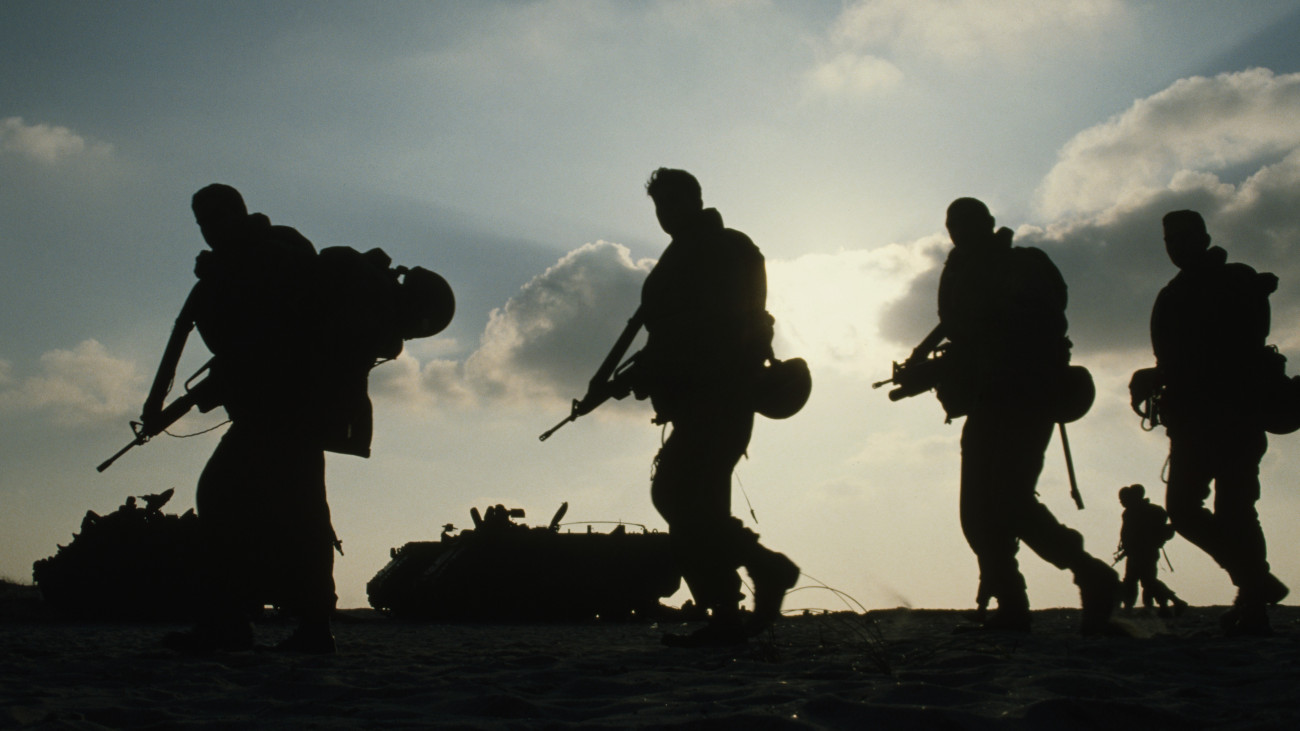 The silhouette of soldiers from the Givati Brigade as they prepare for an amphibious exercise.