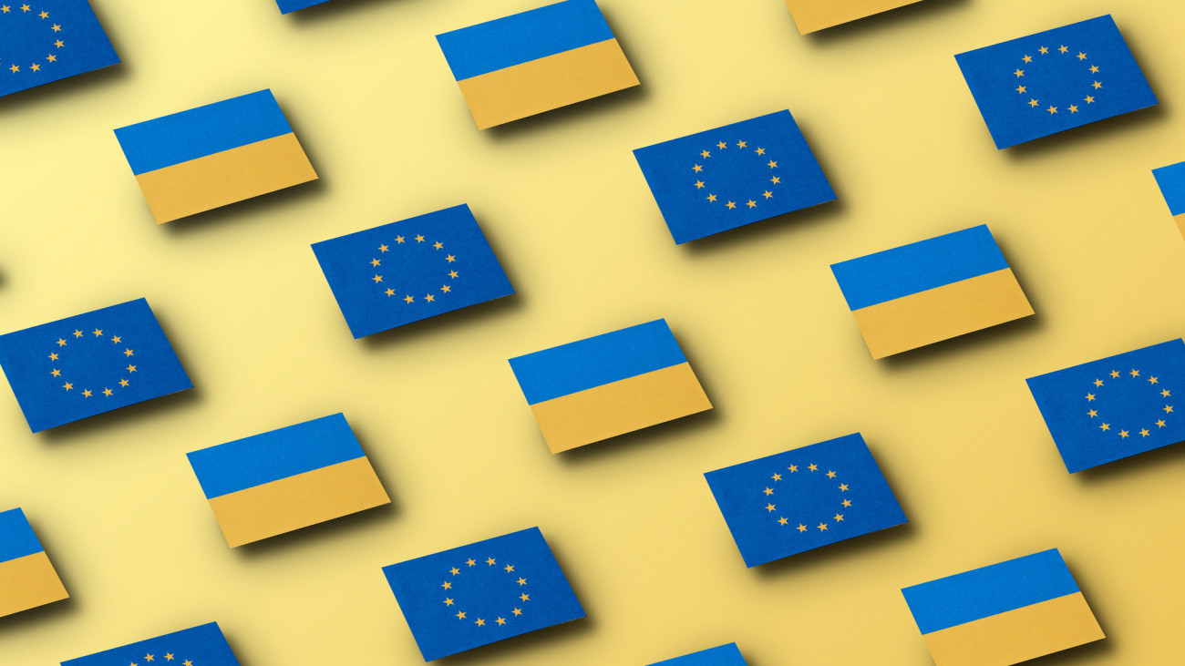 Conceptual image of grid pattern of floating European Union and  Ukrainian flags on a yellow background, Image could U supports Ukraine