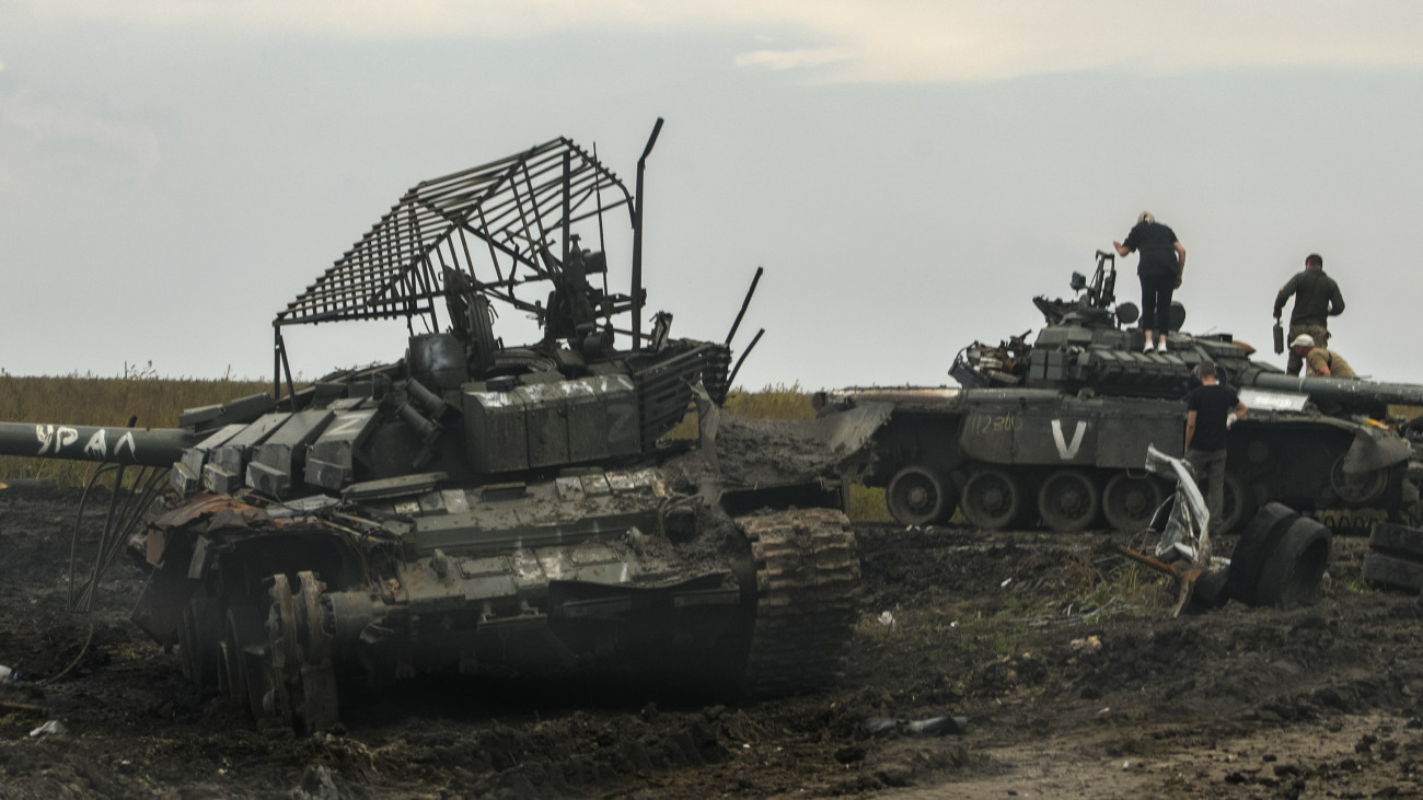 People look at captured Russian tanks in Kharkiv region, Ukraine, September 30, 2022 (Photo by Maxym Marusenko/NurPhoto via Getty Images)