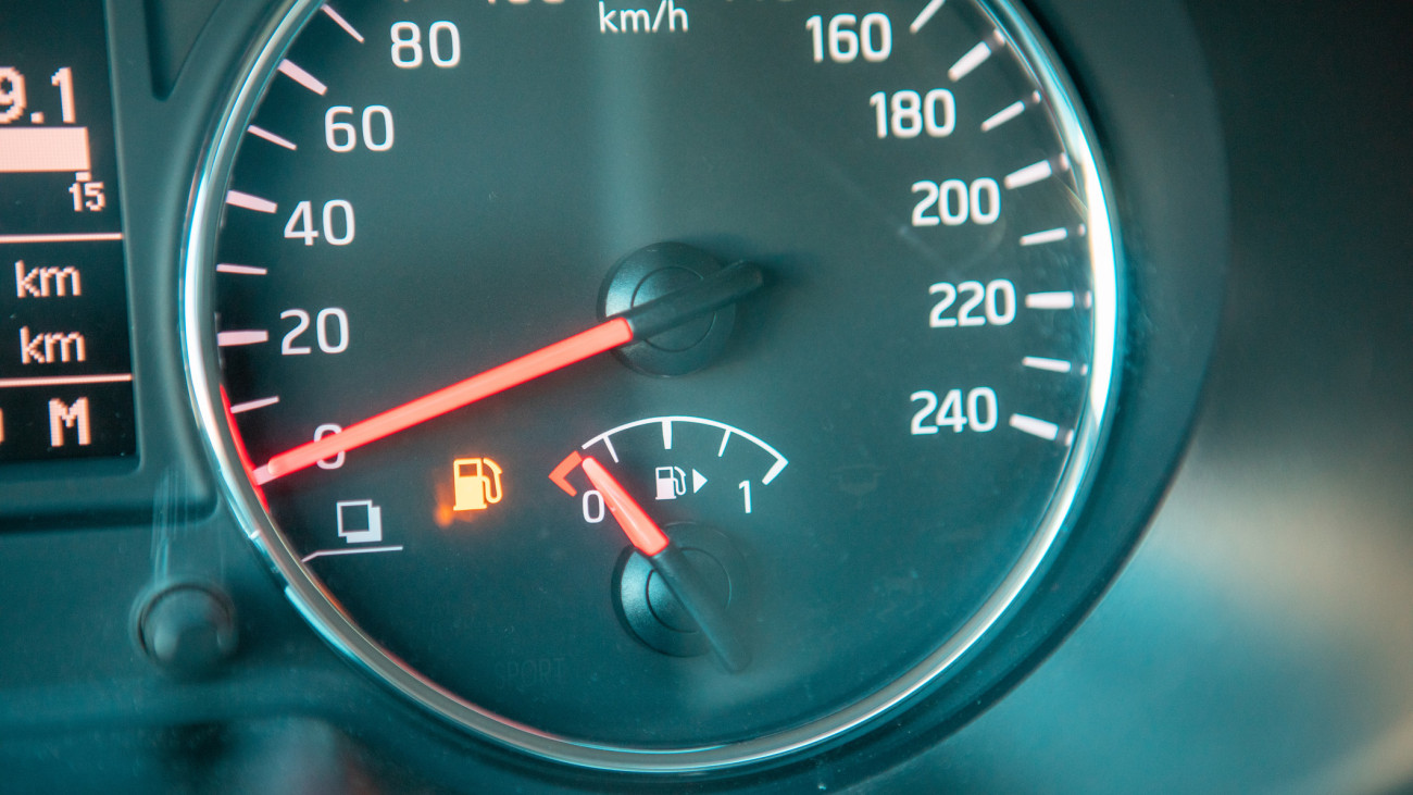 car dashboard close up low fuel warning close up