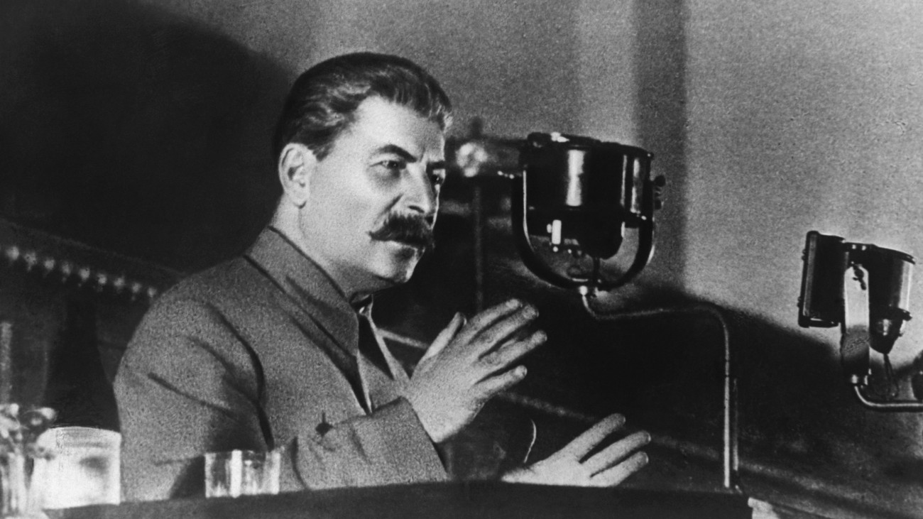 Soviet leader Joseph Stalin reports to the 8th All-Union Congress of Soviets on the draft Constitution of the USSR. (Photo by ÂŠ Hulton-Deutsch Collection/CORBIS/Corbis via Getty Images)