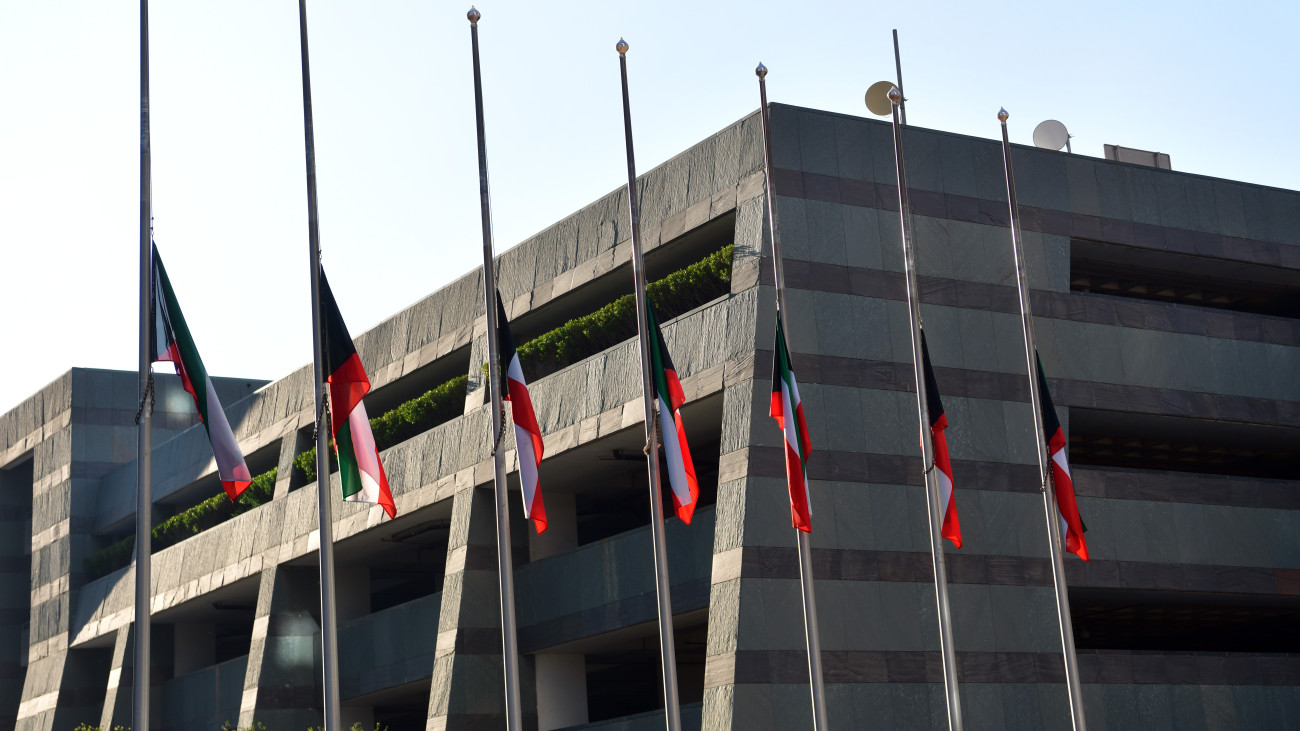 KUWAIT CITY, KUWAIT - DECEMBER 16: A view of Kuwaits national flags are lowered to half-mast as a mark of mourning for the late Emir Sheikh Nawaf al-Ahmad Al-Sabah in Kuwait City, Kuwait on December 16, 2023. Kuwaits Emir Sheikh Nawaf Al Ahmad Al Sabah died on Saturday at the age of 86, his office announced. After serving as crown prince for 14 years, Sheikh Nawaf ruled the country for more than three years. (Photo by Jaber Abdulkhaleq/Anadolu via Getty Images)
