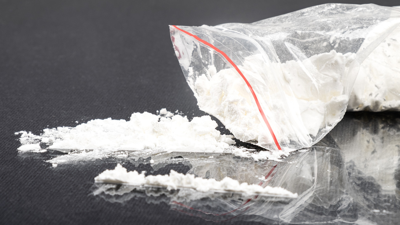 sprinkled white amphetamine powder, concept snuff drug addiction.