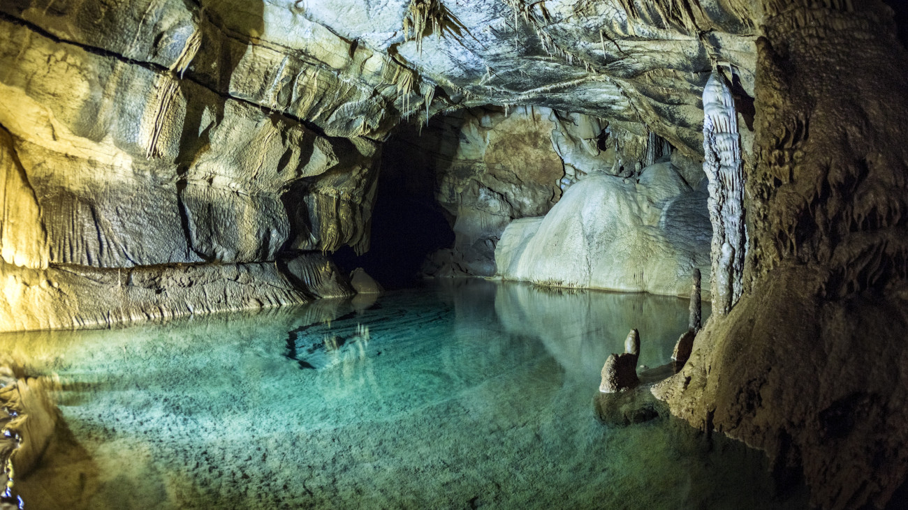 Karst cave Krizna jama, roughly 8-9 km long, from 30 to 125 m deep, lots of chambers, siphons, corridors, small islands and roughly 40 lakes, stalactites, stalagmites and other specifical Karst rock formations.
