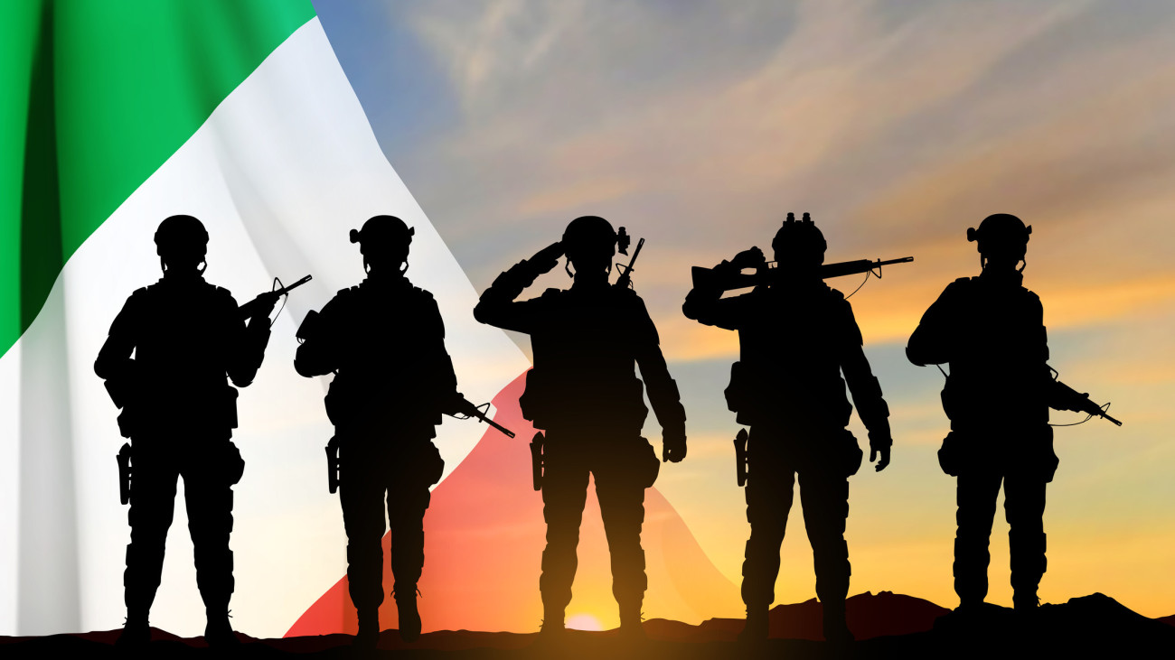 Silhouettes of a soldiers with Italian flag on sunset background. Armed Forces of Italy. EPS10 vector