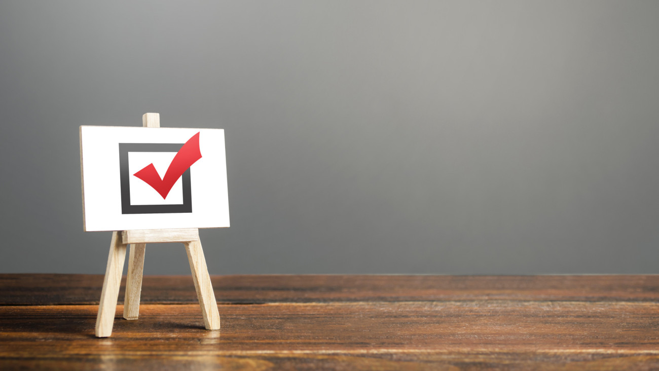 Easel with red voting tick. Checkbox. Democratic elections, referendum. Right to choose, change of power. Checklist verification, self-discipline. Necessary quality criteria, skills, approval symbol