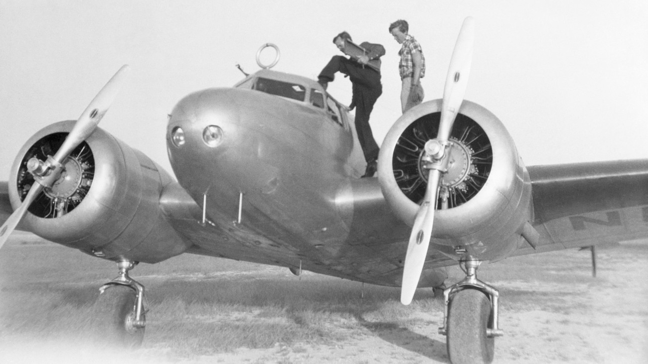 Captain Fred Noonan and pilot Amelia Earhart enter their Lockheed Electra 10E in San Juan, Puerto Rico, during Earharts around-the-world flight attempt. Although not the first around-the-world flight, this will be the longest, following an equatorial route. Earhart and flight navigator Noonan were last heard from on July 2 following their takeoff from Lae, New Guinea.