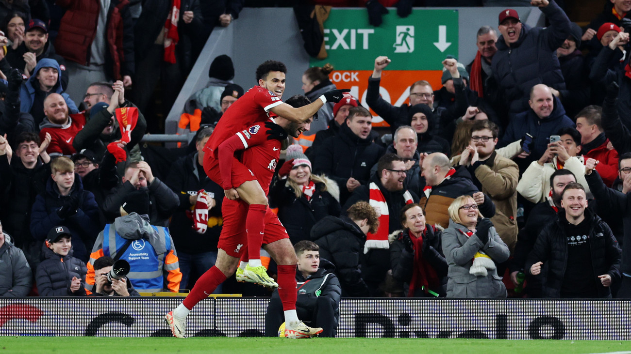 LIVERPOOL, ENGLAND - JANUARY 31: Dominik Szoboszlai of Liverpool celebrates scoring his teams third goal with Luis Diaz during the Premier League match between Liverpool FC and Chelsea FC at Anfield on January 31, 2024 in Liverpool, England. (Photo by Clive Brunskill/Getty Images)