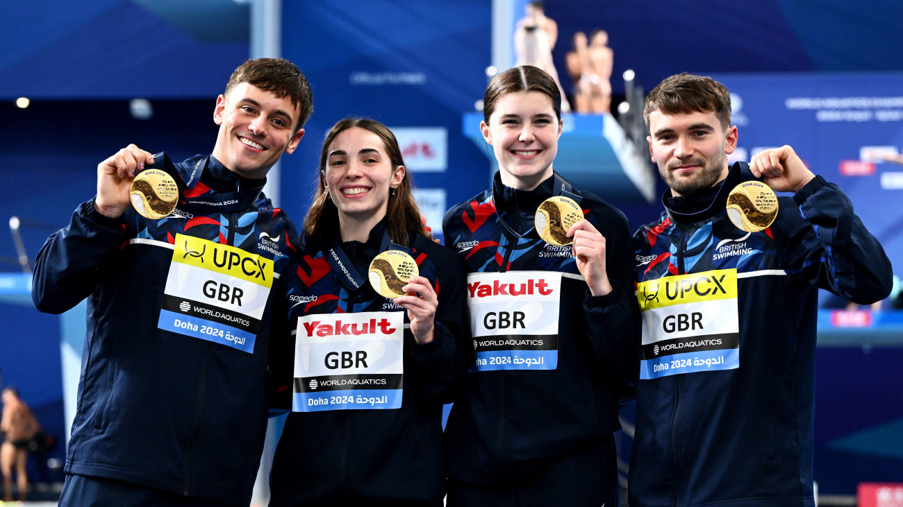 DOHA, QATAR - FEBRUARY 02: Gold Medalists, Daniel Goodfellow, Thomas Daley, Scarlett Mew Jensen and Andrea Spendolini Sirieix of Team Great Britain pose with their medals during the Medal Ceremony after the Mixed Team Event Final on day one of the Doha 2024 World Aquatics Championships at Hamad Aquatic Centre on February 02, 2024 in Doha, Qatar. (Photo by Quinn Rooney/Getty Images)