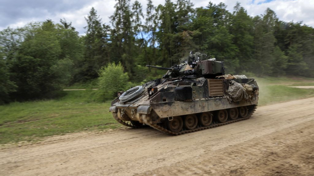 A US Army M2 Bradley infantry fighting vehicle during the Combined Resolve 17 multinational training exercise, with participating forces from Belgium, Bosnia, Czech Republic, Estonia, Greece, Italy, Kosovo, Moldova, North Macedonia, Poland and US, at the Hohenfels Training Area in Hohenfels, Germany, on Wednesday, June 8, 2022. Combined Resolve is a multinational exercise conducted at the Joint Multinational Readiness Center, designed to test and certify brigade combat teams, as well as build interoperability with US allies and partners. Photographer: Alex Kraus/Bloomberg via Getty Images