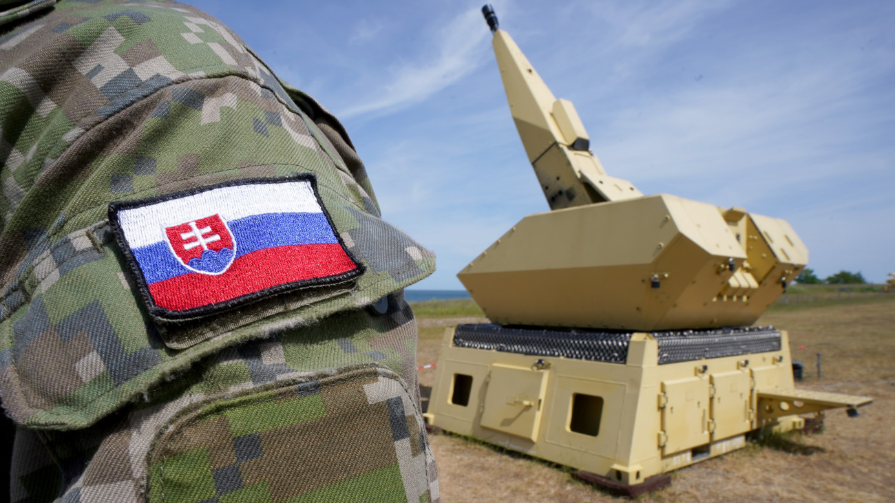 31 May 2023, Schleswig-Holstein, Todendorf: A Slovak soldier stands in front of a gun of the Mantis (Modular, Automatic and Network Capable Targeting and Interception System) air defense weapon system during training by the Air Force at the Todendorf training area. Until the end of June, the Air Force is training soldiers from Slovakia on the Mantis air defense weapon system. According to the Air Force, the training of the 44 Slovakian soldiers serves to further strengthen NATOs eastern flank. The system can be used to protect facilities and infrastructure from rocket and artillery fire as well as mortars. Photo: Marcus Brandt/dpa (Photo by Marcus Brandt/picture alliance via Getty Images)