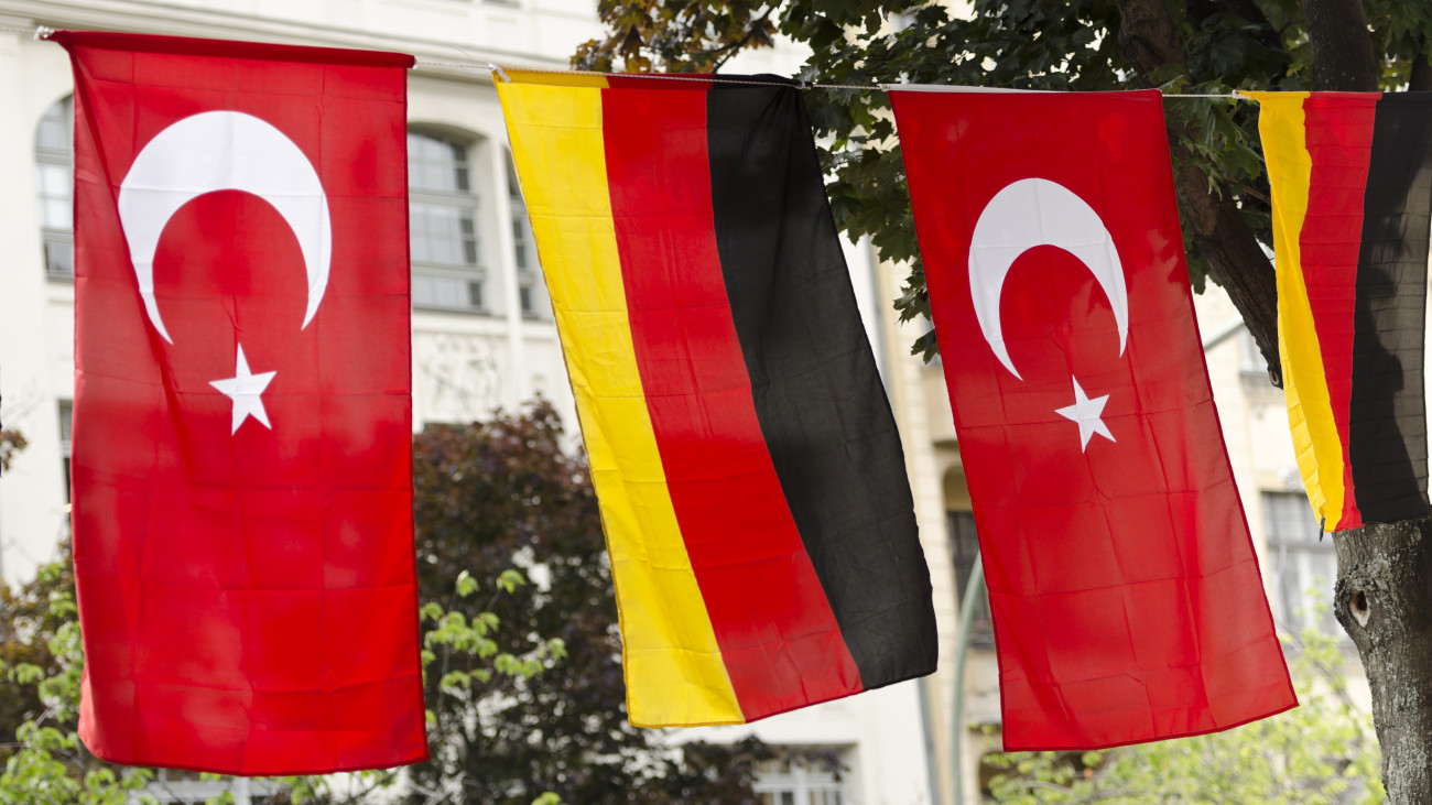 Flags of Germany and Turkey hanging outside on a street in Kreuzberg, Berlin.