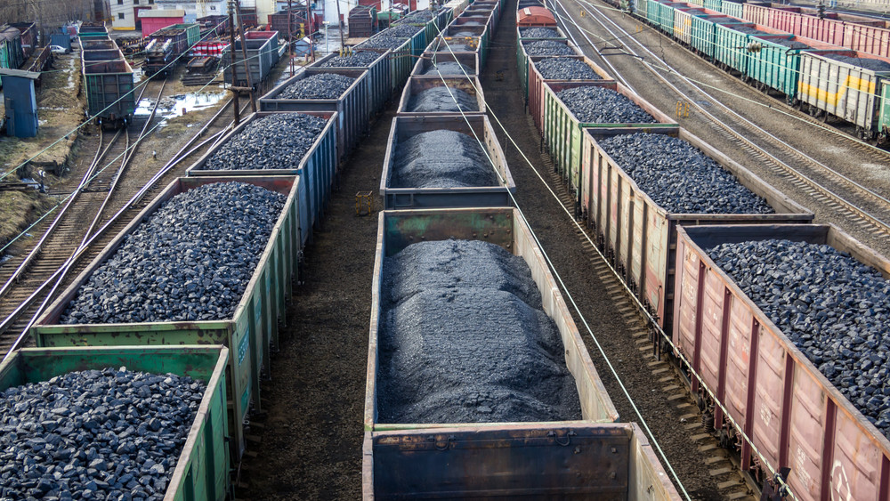 Murmansk, Russia - April 22, 2019: Coal-filled cars at the Murmansk station