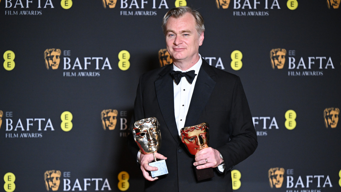 LONDON, ENGLAND - FEBRUARY 18: Christopher Nolan poses with the Best Film Award for Oppenheimer in the winners room at the 2024 EE BAFTA Film Awards at The Royal Festival Hall on February 18, 2024 in London, England. (Photo by Stephane Cardinale - Corbis/Corbis via Getty Images)
