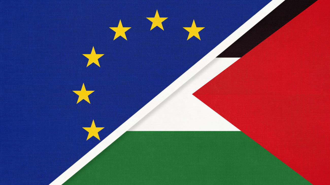 European Union or EU and State of Palestine national flag from textile. Symbol of the Council of Europe association opposite Asian country. Europe championship