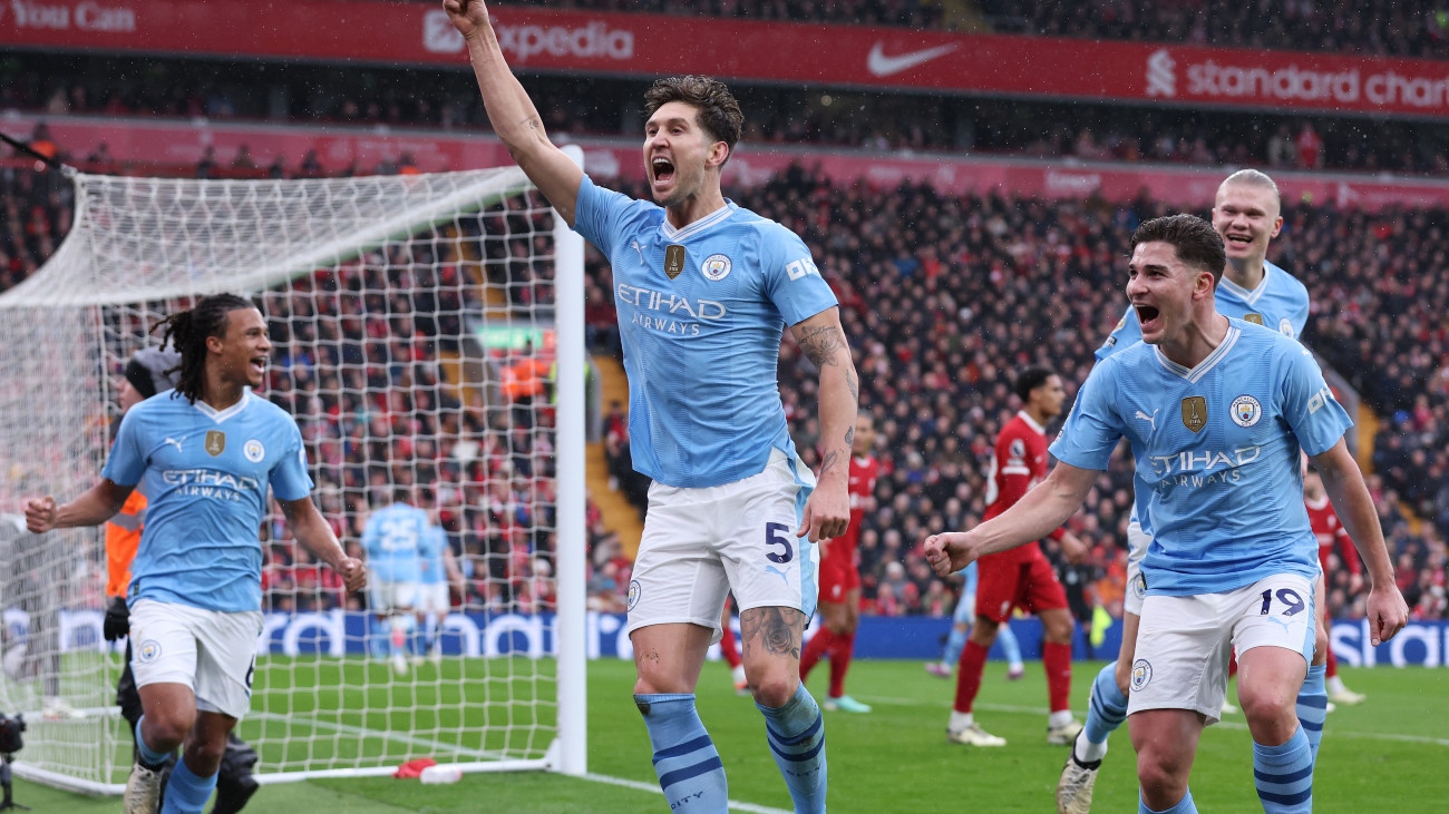 LIVERPOOL, ENGLAND - MARCH 10: John Stones of Manchester City celebrates after scoring their opening goal during the Premier League match between Liverpool FC and Manchester City at Anfield on March 10, 2024 in Liverpool, England. (Photo by Alex Livesey - Danehouse/Getty Images) (Photo by Alex Livesey - Danehouse/Getty Images)