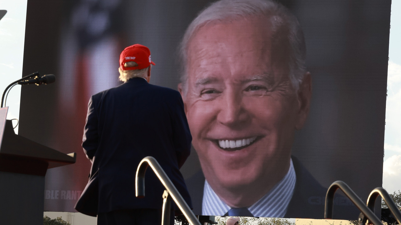 MIAMI, FLORIDA - NOVEMBER 06: Former U.S. President Donald Trump watches a video of President Joe Biden playing during a rally for Sen. Marco Rubio (R-FL) at the Miami-Dade Country Fair and Exposition on November 6, 2022 in Miami, Florida. Rubio faces U.S. Rep. Val Demings (D-FL) in his reelection bid in Tuesdays general election.  (Photo by Joe Raedle/Getty Images)