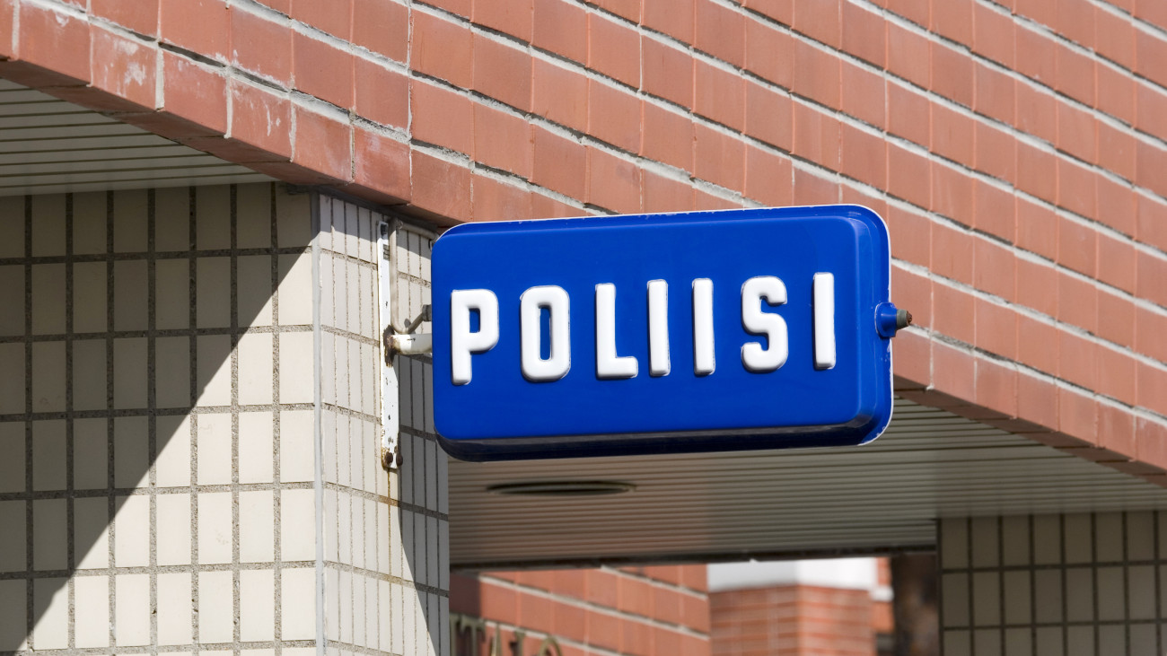 Finnish police sign on building wall, Finland Europe