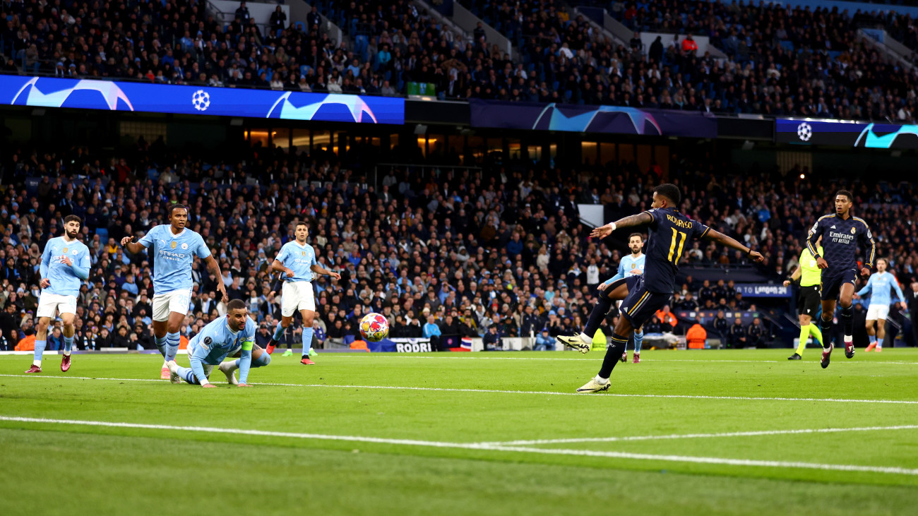 MANCHESTER, ENGLAND - APRIL 17: Rodrygo of Real Madrid scores his teams first goal during the UEFA Champions League quarter-final second leg match between Manchester City and Real Madrid CF at Etihad Stadium on April 17, 2024 in Manchester, England.(Photo by Marc Atkins/Getty Images)