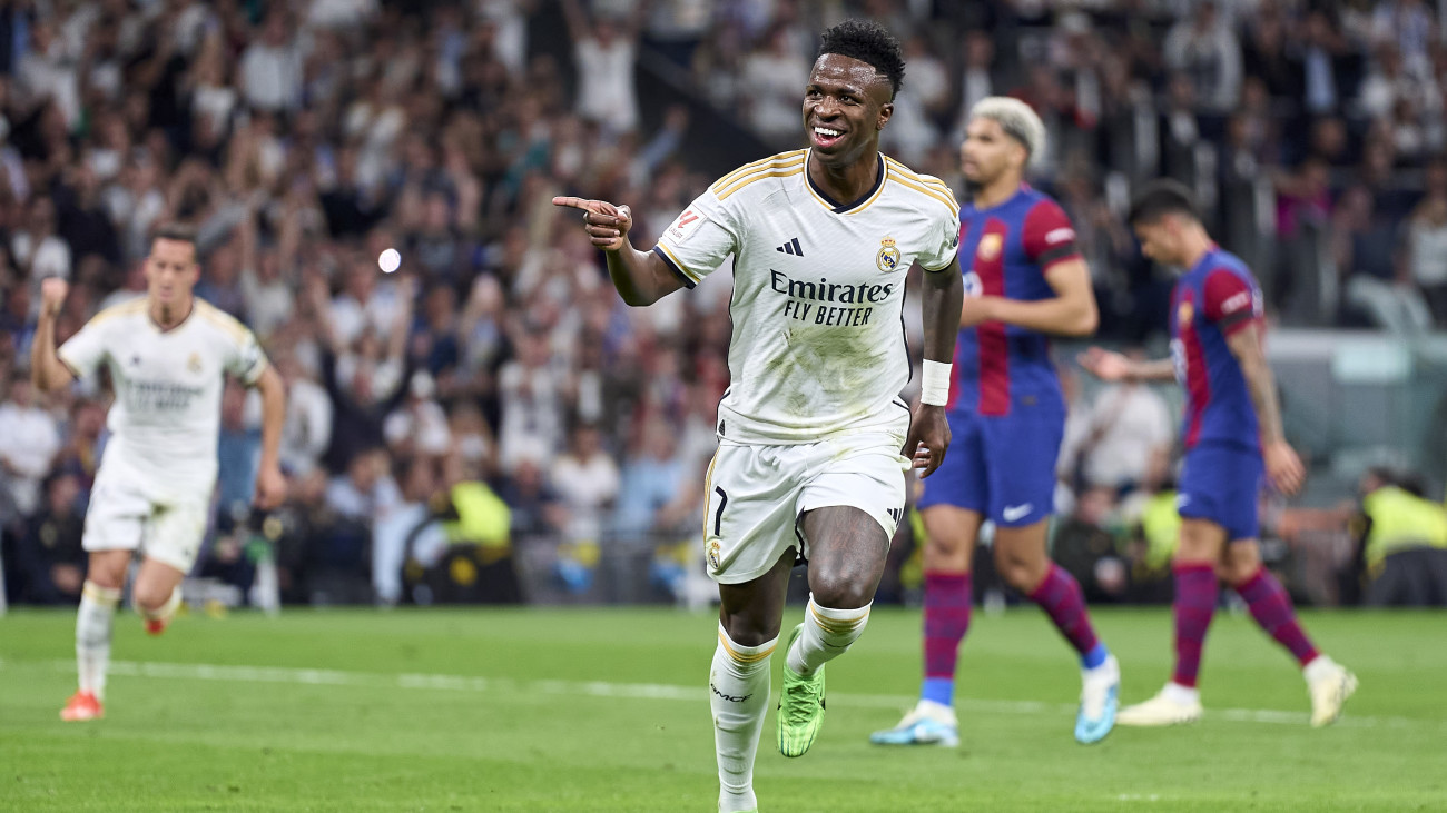 MADRID, SPAIN - APRIL 21:  Vinicius Junior of Real Madrid celebrates after scoring his teams first goal during the LaLiga EA Sports match between Real Madrid CF and FC Barcelona at Estadio Santiago Bernabeu on April 21, 2024 in Madrid, Spain. (Photo by Jose Manuel Alvarez/Quality Sport Images/Getty Images)