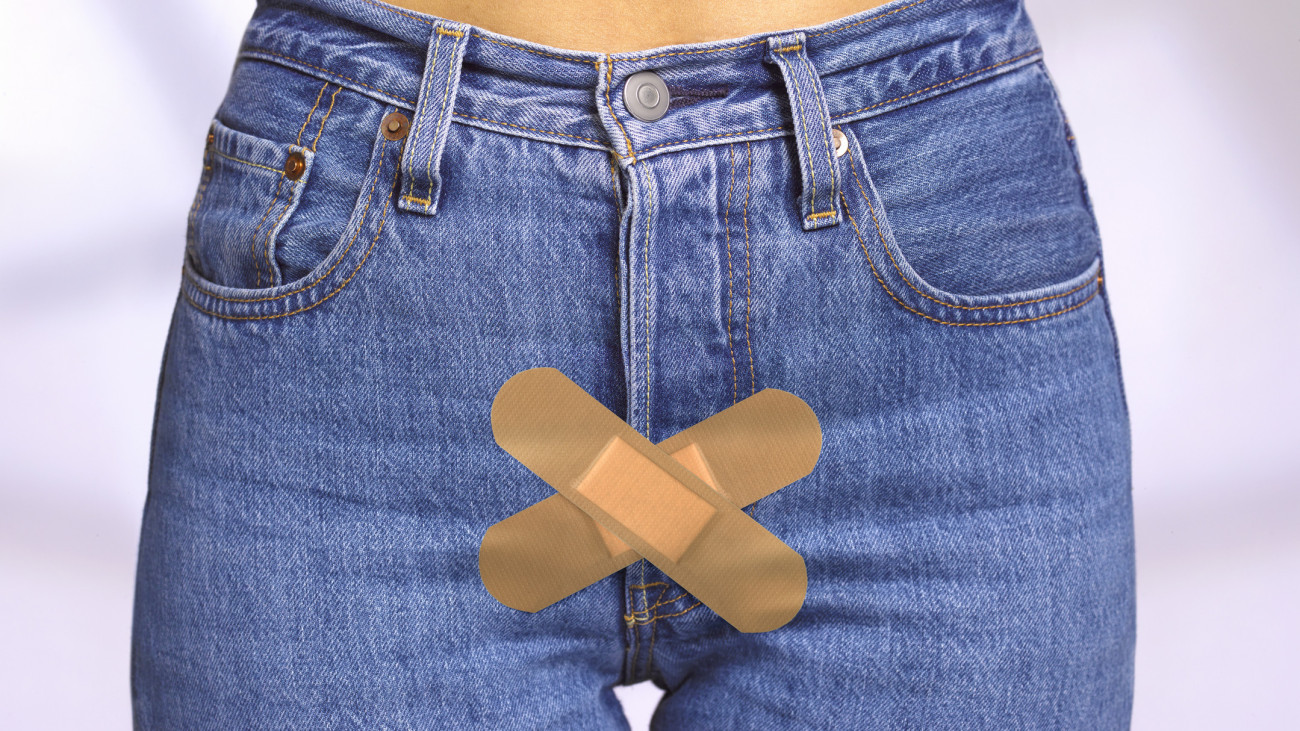 womans jeans with sticking plasters to illustrated STI and STD