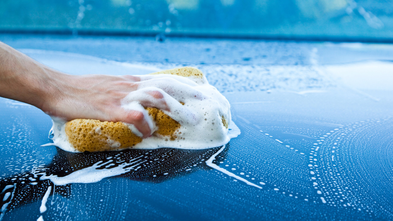 Car wash with yellow sponge.