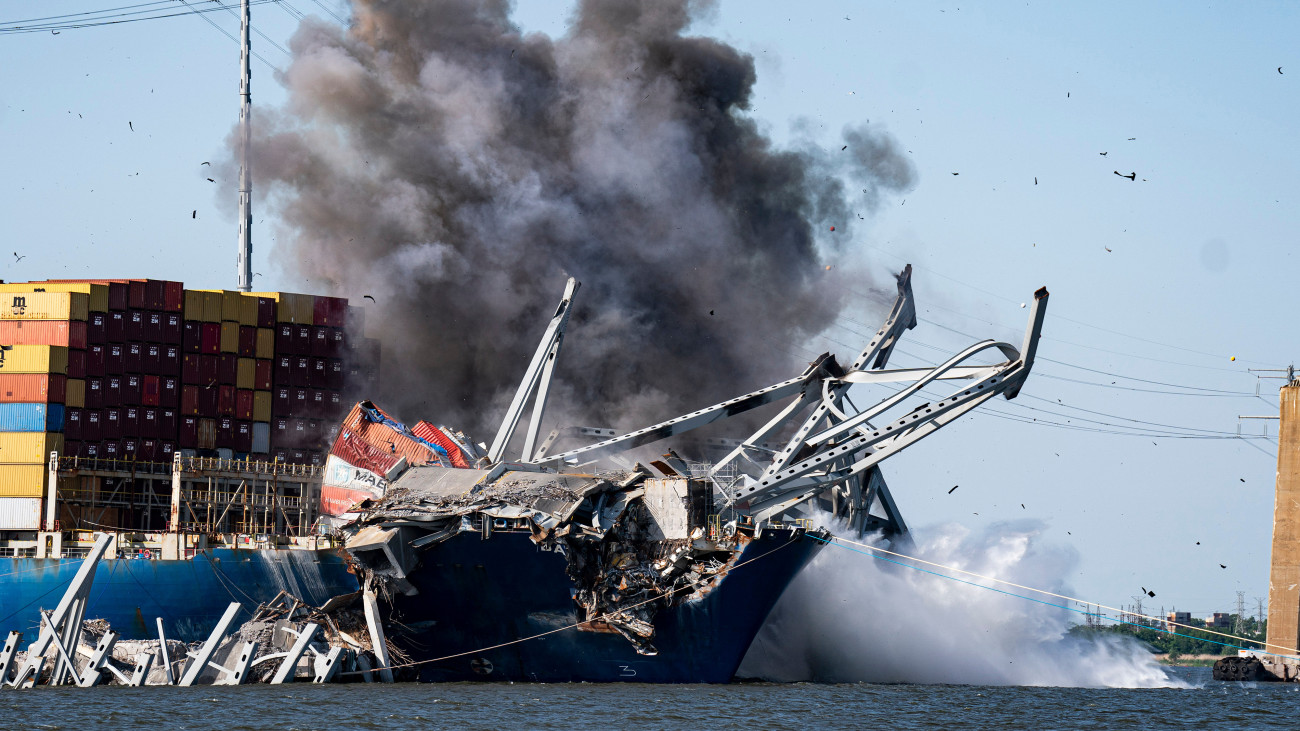The Dali container vessel and the Francis Scott Key Bridge that collapsed into the Patapsco River during a controlled demolition in Baltimore, Maryland, US, on Monday, May 13, 2024. Crews are performing a controlled demolition to help clear wreckage from the bow of the Singapore-flagged Dali so salvage crews can float the vessel out of the harbor, as authorities hope to fully reopen the channel by the end of May. Photographer: Al Drago/Bloomberg via Getty Images