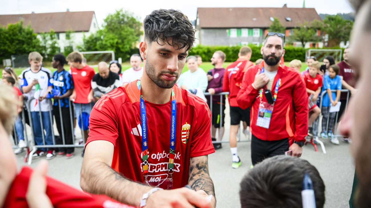 12 June 2024, Bavaria, Weiler-Simmerberg: Soccer, preparation for UEFA Euro 2024, training Austria, Dominik Szoboszlai (M) signs autographs for the fans after the Hungarian national teams training session. Photo: Tom Weller/dpa (Photo by Tom Weller/picture alliance via Getty Images)