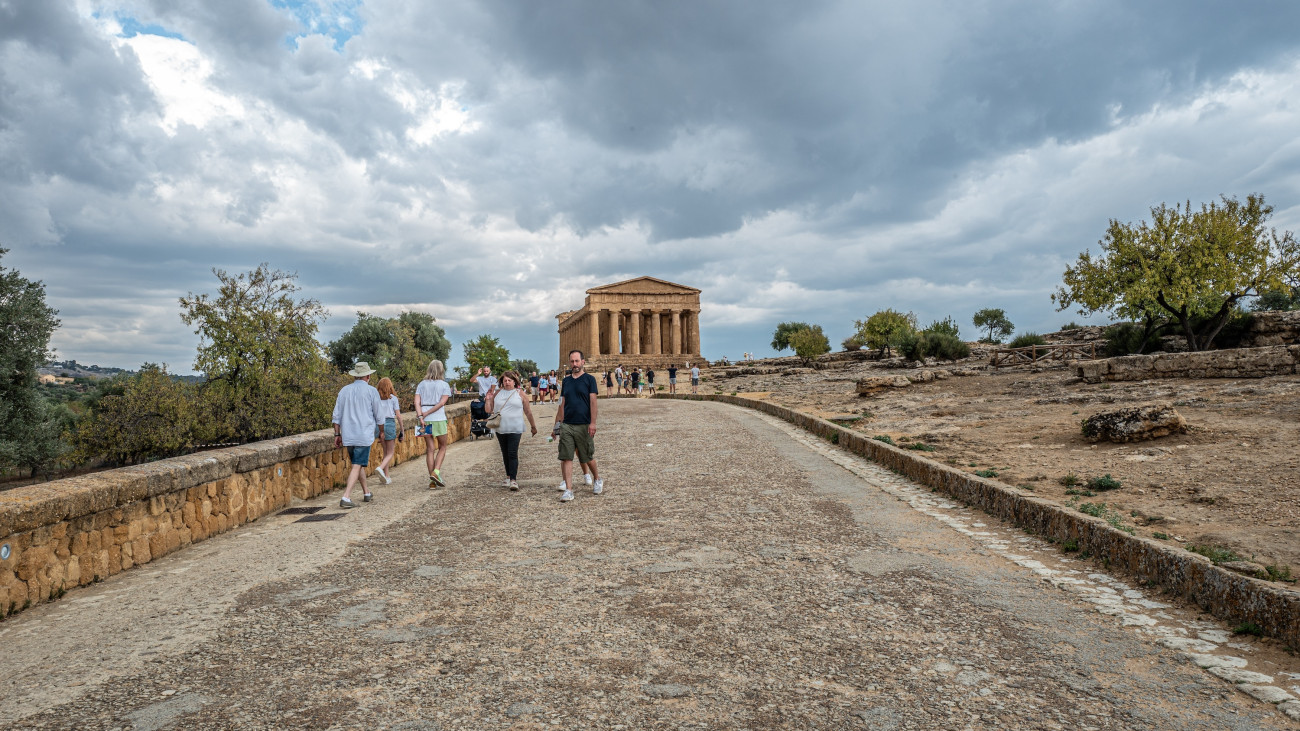 AGRIGENTO, ITALY - SEPTEMBER 07: Tourists visiting the Temple of Concordia in the Valley of the Temples on September 07, 2023 in Agrigento, Italy. The Valley of the Temples includes the ruins of seven temples, the city walls, the agora, the Roman forum, the necropolis and the rock sanctuaries. Agrigento will be the Italian Capital of Culture 2025. (Photo by Fabrizio Villa/Getty Images)