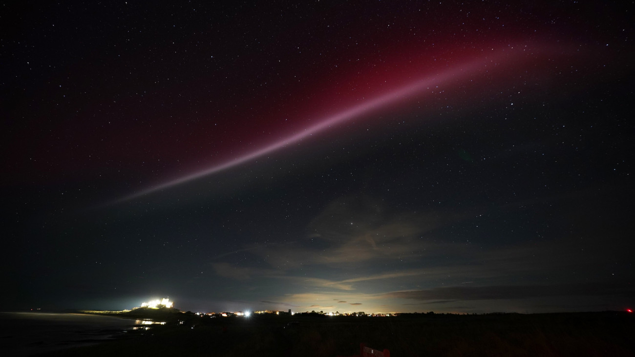 A strong thermal emission velocity enhancement, a rare aurora-like phenomenon named a STEVE in 2016 by scientists in Canada, can be seen over Bamburgh castle, in Northumberland on the North East coast of England. The atmospheric optical phenomenon is caused by a flowing ribbon of hot plasma breaking through into the earths ionosphere, appearing in the sky as a purple, red and white arc. Picture date: Sunday November 5, 2023. (Photo by Owen Humphreys/PA Images via Getty Images)